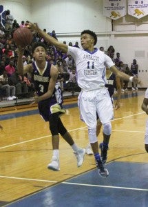 Michael Murray/Americus Times-Recorder:    Eric Hall leaps up to block a Bainbridge shooter during the Panthers’ Feb. 5 contest in Americus. Hall led the Panthers to victory against Lee County on Feb. 6 with 16 points.