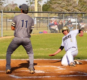 Michael Murray/Americus Times-Recorder: Southland’s Michael Hudgens slides into home plate on a passed ball during the second inning of the Raiders’ March 8 contest against Tiftarea. *Image has been altered to remove an extraneous element.