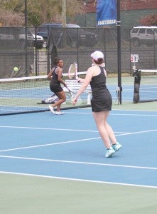 Michael Murray/Americus Times-Recorder:   ASHS’ Bailey Roberson returns a volley as her doubles partner, Karia Hadley, gets into position during the March 12 match. Roberson and Hadley won their first match of the series, but fell in the second.