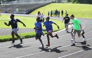 Michael Murray/Americus Times-Recorder: Runners from Sumter County compete in the 100-meter dash during the Special Olympics in Americus on April 29.