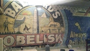 The mural originally served as an advertisement for the Ballard Obelisk Flour Co.