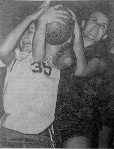Submitted by Melvin Kinslow: Irene Manning, a member of the 1966 Pantherettes, battles for possession of the ball over a Cochran player in the final round of the state championship tournament.