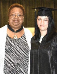 A GED graduate from Marion County with her instructor.