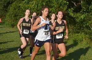 Photo by Angie Bell:   The Southland pack of Alex Exum, Paisley Greene, Lilli Dickens and Sydney Hayes surrounds a Tift County runner during the Lee County Cross Country Invitational.