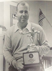 From the 1987 Southland Academy yearbook:   The 1986 Raiders’ head coach, Loveard McMichael displays the state championship trophy.