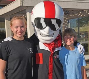 Submitted by South Georgia Technical College:   SGTC mascot, Ace, stopped for a photo op with a pair of local students recently at Giggles.