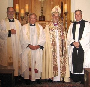 From left are Father Curtis Mears, Father Jim Parker (St. John's active priest), Archbishop Foley Beach (of the Anglican Diocese of the South), and Father Will McQueen.