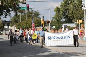 Michael Murray/Americus Times-Recorder: A pair of Kiwanians led the Pet Parade, followed by members of local Boy Scout Troop 21.