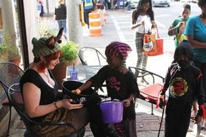 Michael Murray/Americus Times-Recorder: This swashbuckling pirate put her plundering ways aside and politely picked out a tasty treat in front of Cafe Campesino.