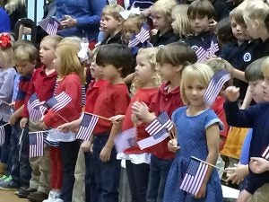 The students seemed to enjoy waving their American flags and singing patriotic songs at Southland Academy’s  annual Salute to Veterans held Thursday.  Read more about the program and see more photos in Wednesday’s edition, along with other local veterans’ events news.