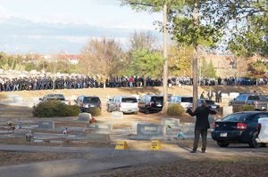 The caisson carrying Officer Nick Smarr's casket was followed by a multitude of law enforcement and community members who walked from the GSW Storm Dome to Oak Grove Cemetery.