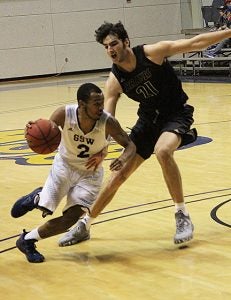 MICHAEL MURRAY I ATR: GSW’s Brandon Price blazes past a UNC Pembroke defender on Dec. 19 in Americus. Price hit five three-pointers in the tilt on his way to to contributing 30 points to the GSW cause.