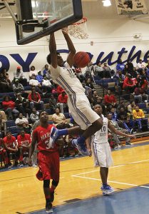 MICHAEL MURRAY I ATR:   ASHS’ Kiante Sims recovers after stuffing in a dunk in the first quarter of the Panthers’ Dec. match-up with the Marion County Eagles in Americus.