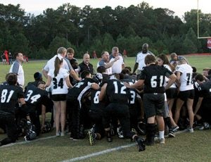 MICHAEL MURRAY I ATR:   Schley County head football coach, Darren Alford (center), addresses his team in this photo from the Oct. 26, 2016 edition of the Times-Recorder. 