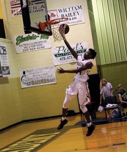 MICHAEL MURRAY I ATR: Southland’s Saige Batten (14) takes it to the hole in the Raiders’ Jan. 3 home contest against Westfield. Batten contributed 12 points, three assists, and one block to the Raiders’ win.