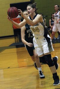 MICHAEL MURRAY I ATR:   Southland’s Savanna Banks fires aoff a pass in the Lady Raiders’ Jan. 3 tilt against the Lady Hornets. Banks contributed 10 points to the Southland victory.