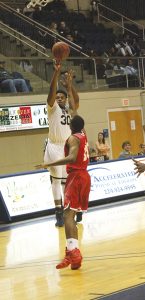 MICHAEL MURRAY I ATR:   GSW’s Tevin Wise tosses up one of his five connections from long range during the Hurricanes’ Jan. 9 tilt against Flagler. Wise contributed 23 points to the GSW win.