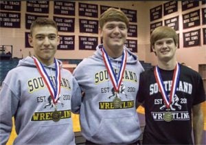 SUBMITTED BY LORI TURTON:   The three senior members of the Raiders’ wrestling team each won Region 3-IAAA titles in their respective divisions. Pictured above, from left, are Billy Calcutt, Stephen Turton, and Tanner Rundle.